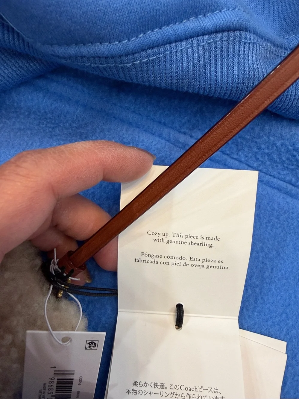 COACH Cream Shearling Bear Bag Charm with Brown Leather Strap